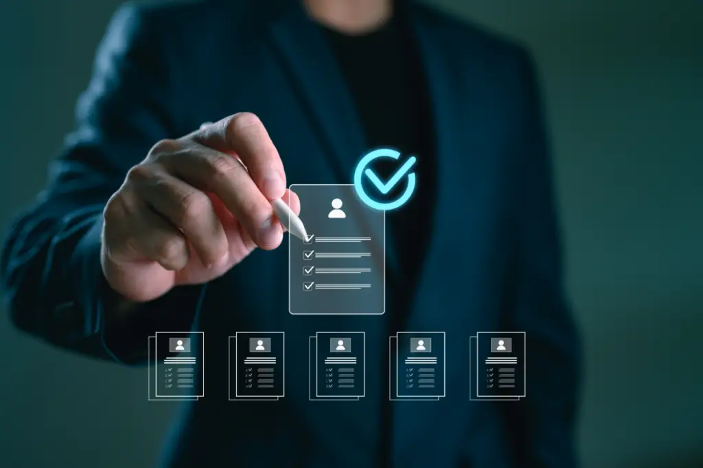 A man viewing candidates for a L&D staffing agency.