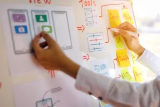 LX designer creating a learner-centric journey map using UX design principles.